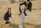 photo of family having fun with soccer ball