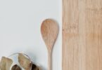 brown wooden spoon on white surface