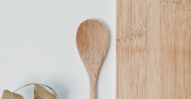 brown wooden spoon on white surface