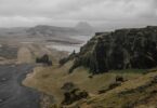 overcast scenery with mountains and coastline